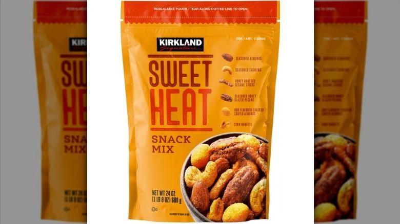 Kirkland sweet heat snack mix in an orange and red bag on white background