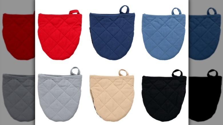 Assorted mini oven mitts on white background