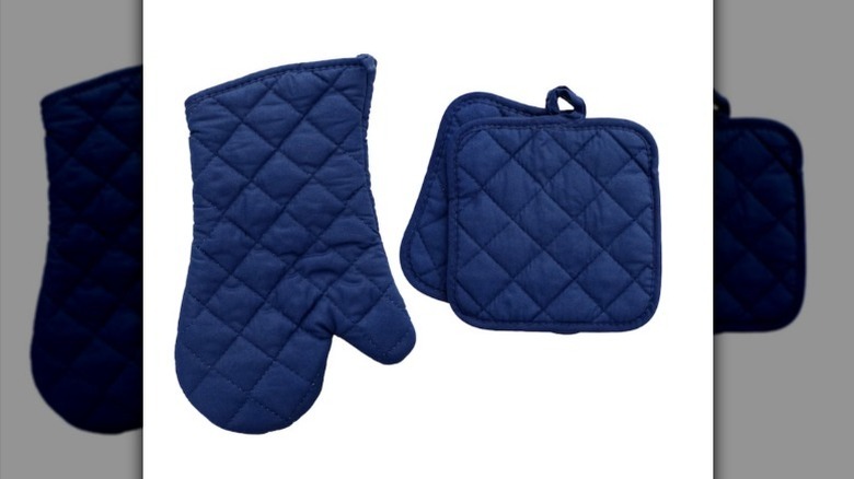 Navy blue oven mitt set on white background