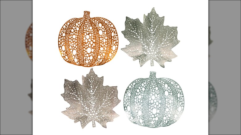 leaf and pumpkin-shaped metallic placemats with white background