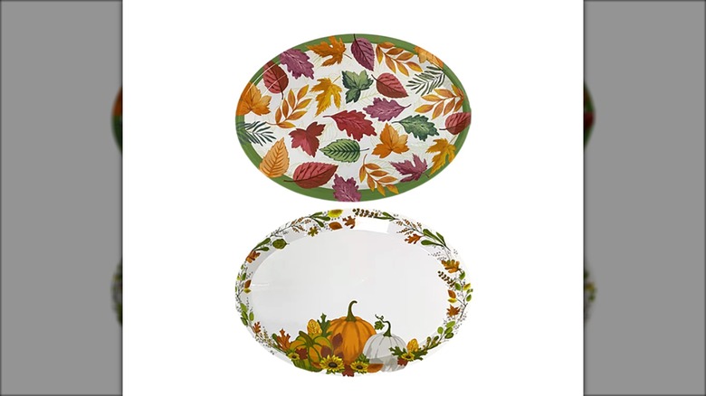 Oval-shaped fall-themed serving platters with white background