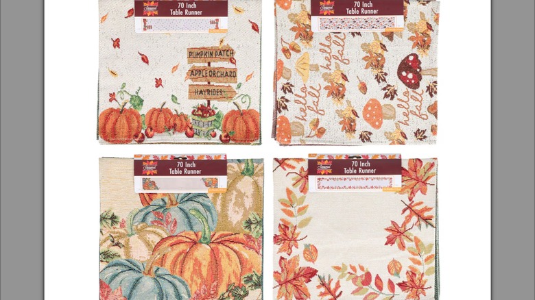 fall-themed tablerunners with blue and orange pumpkins, mushrooms, and fall colors, with a white background