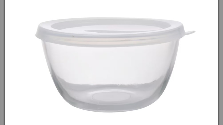 A clear bowl with a lid on a white background
