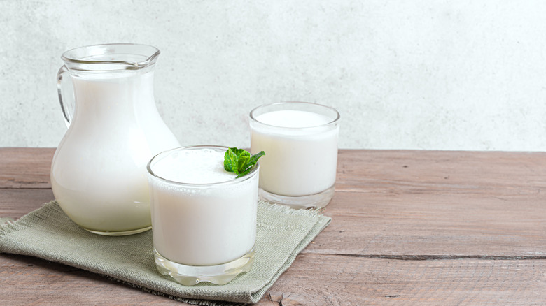 Pitcher and glasses of buttermilk