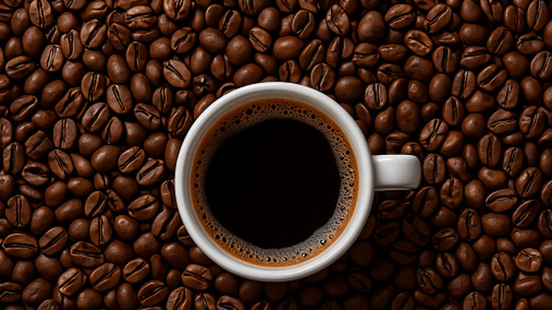 Cup of coffee and coffee beans