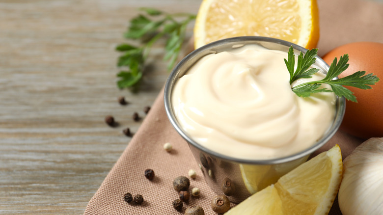 Bowl of mayonnaise and lemon wedges