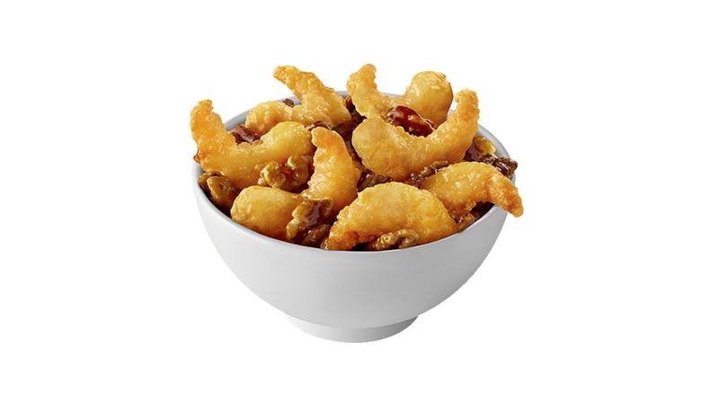 Bowl of Panda Express Honey Walnut Shrimp against white background.