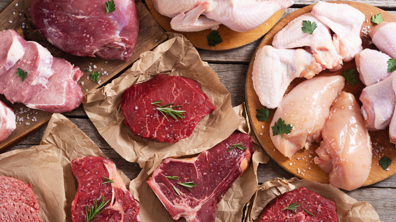 Raw pieces of beef and chicken