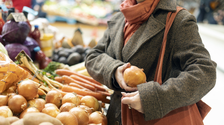 Woman stealing onions