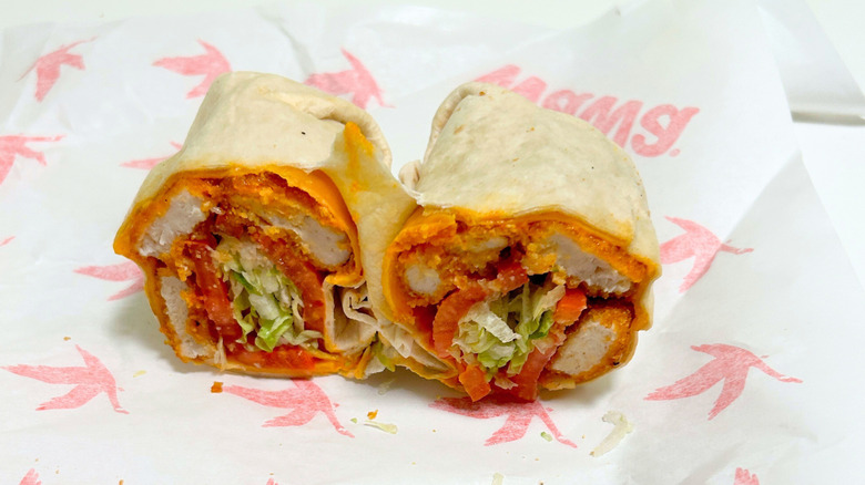 A Wawa Buffalo Chicken Snack and Go Wrap on a Wawa paper