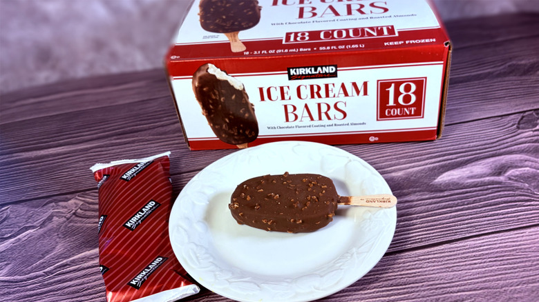 Chocolate nut ice cream bat on plate with package