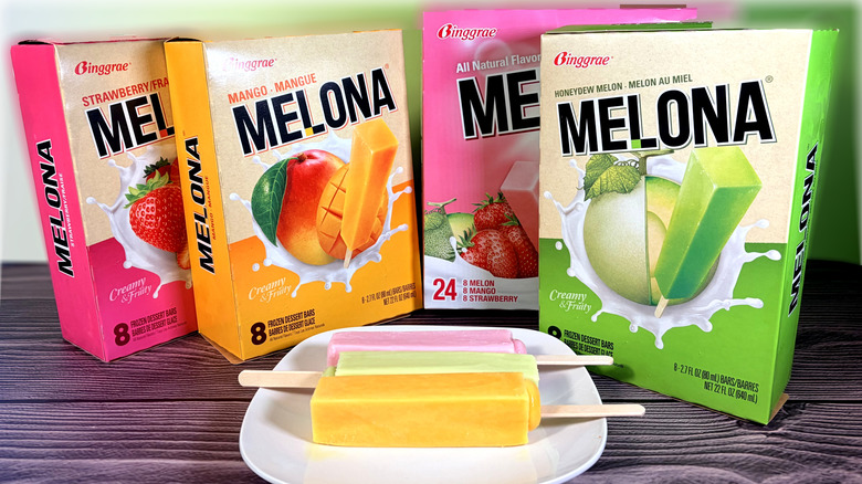 Boxes of three flavors of fruit bars with bars on plate