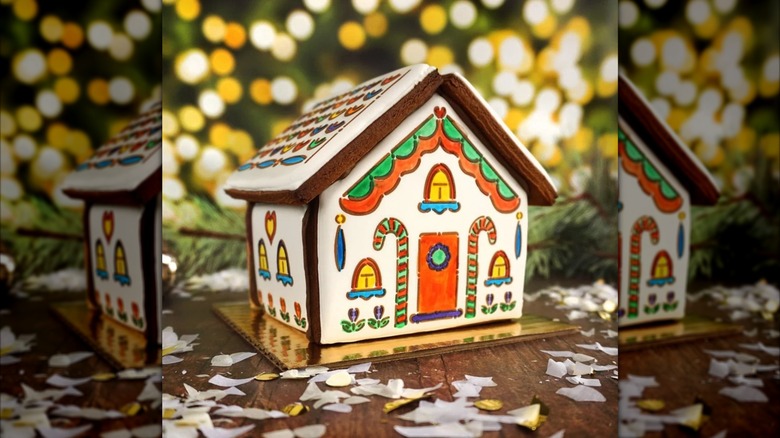 A gingerbread house with painted-on decorations