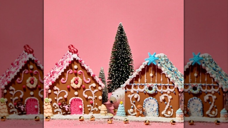 Twin gingerbread houses, decorated with strong pink and light blue themes