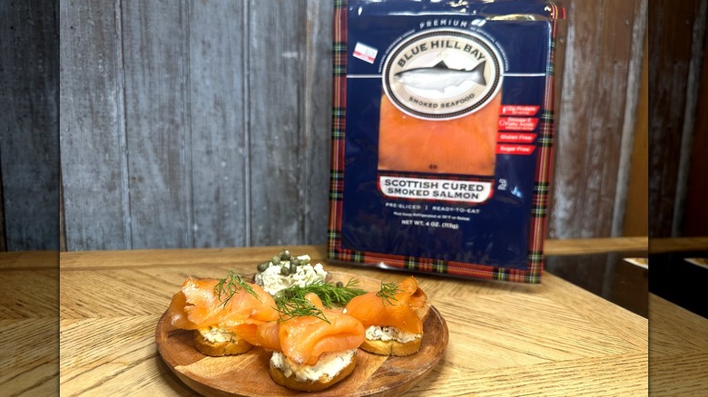 Blue Hill Bay smoked salmon on crackers with dill and capers and cream cheese
