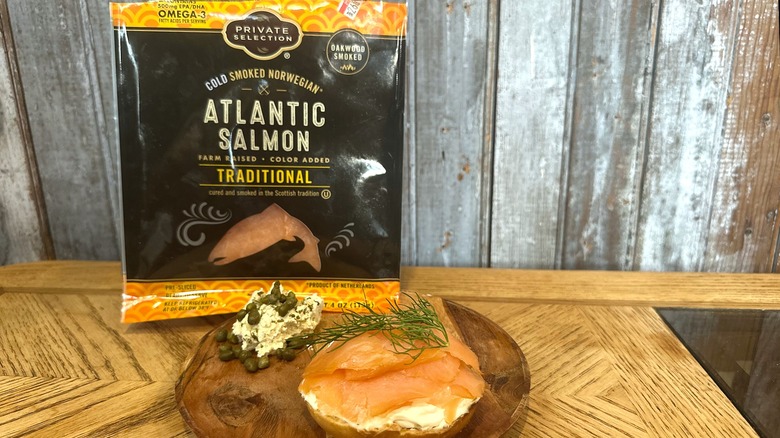 Private Selection Atlantic salmon on a bagel with cream cheese, dill, and capers on a plate
