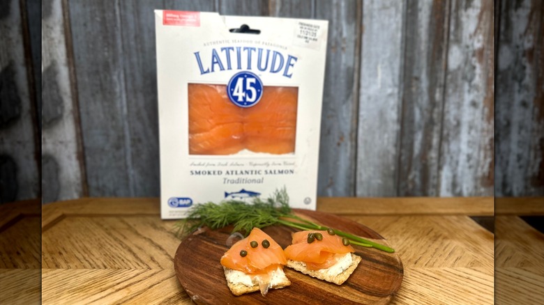 Latitude 45 sliced smoked salmon on a plate with cream cheese, crackers, dill and capers