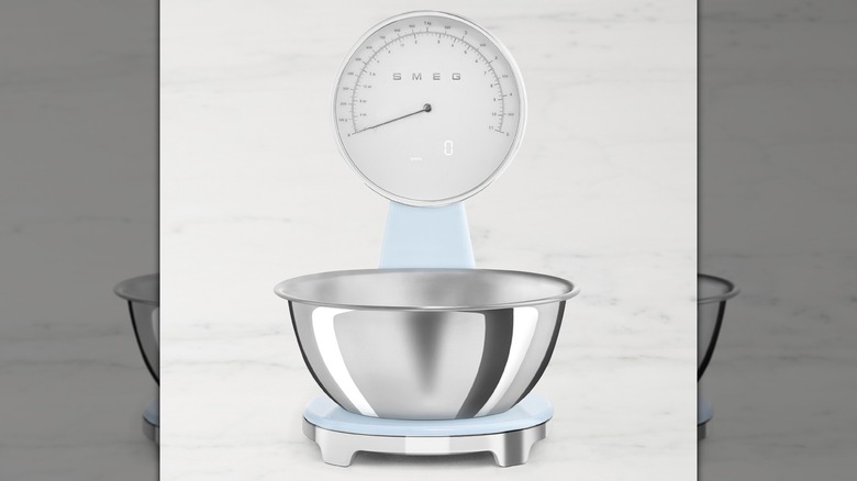 A light blue SMEG Kitchen Scale on a countertop