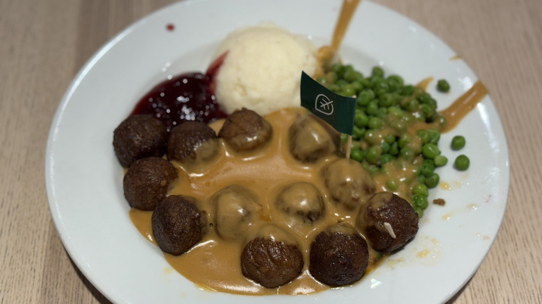 Plant-based IKEA meatballs with sides on a white plate