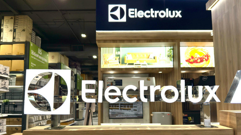Electrolux logo on a window into an appliance store.