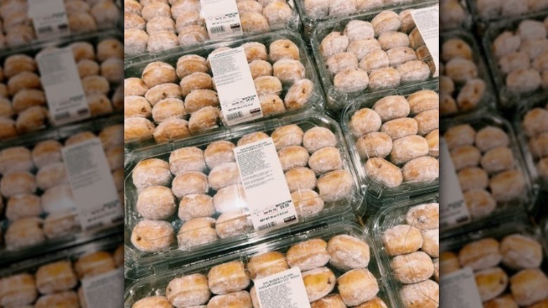 Line of mini beignet containers at Costco.