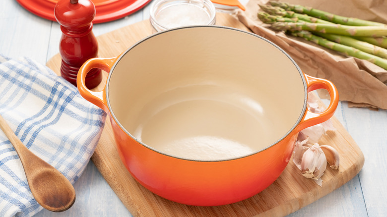 Inside shot of enameled cast iron pan on cutting board
