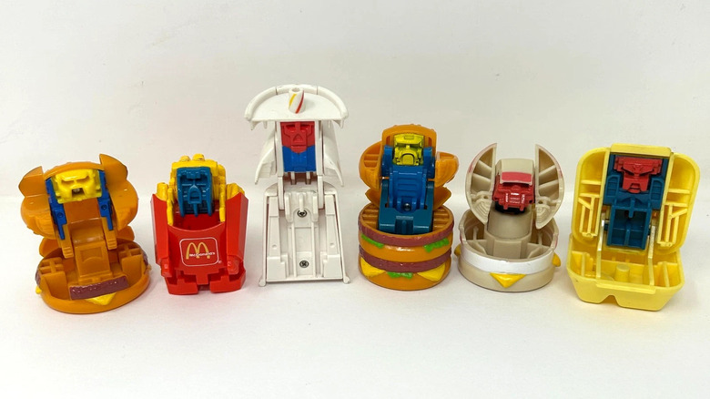 Six Changeables, in their robot form, against a white backdrop