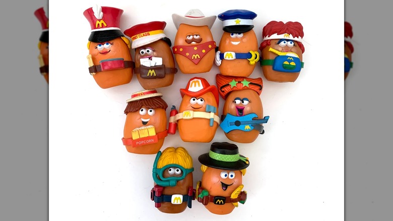 A collection of McNugget buddies in different costumes against a white backdrop