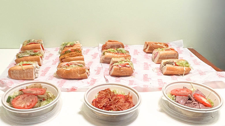 Several Wawa hoagies and no-bun hoagies arranged together