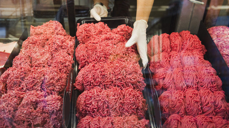 Bins of raw ground beef