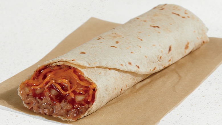 Bean burrito sitting on brown napkin