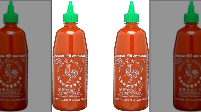 two Huy Fong Sriracha bottles