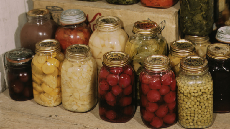 A pantry shelf filled with a wide selection of home canned vegetables