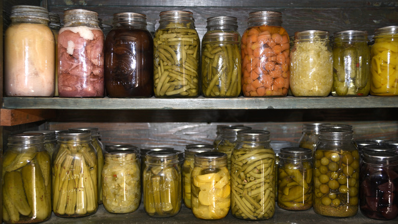 Pantry shelves lined with various home canned goods