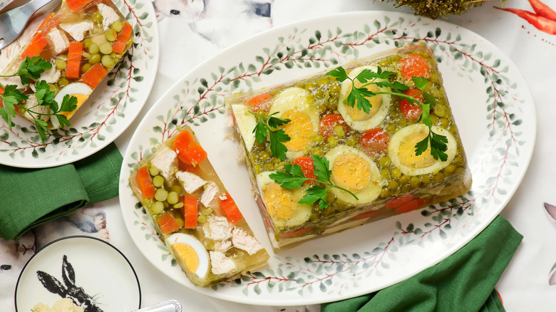 Overhead view of a loaf of aspic sliced on a plate
