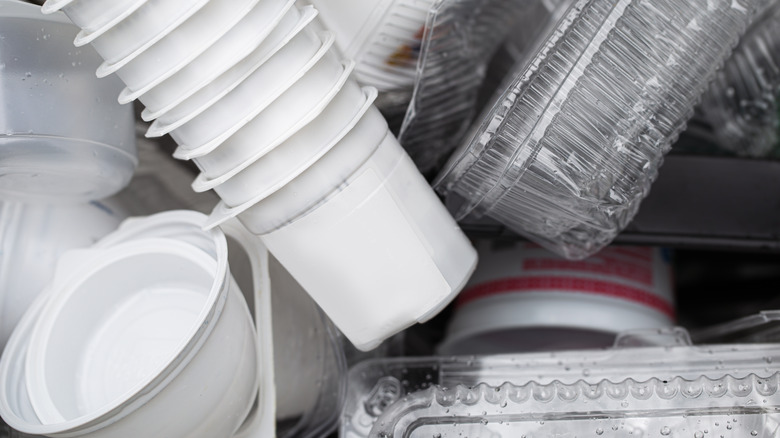 Close-up on an assortment of disposable plastic containers washed for reuse