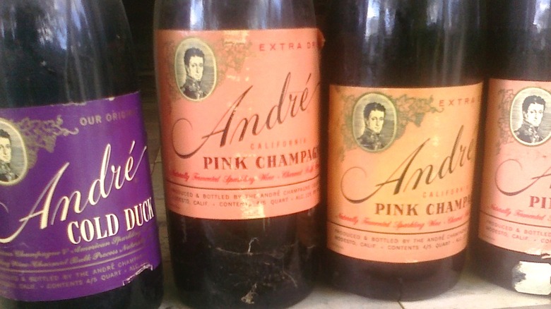 Four old bottles of various types of Andre sparkling wine