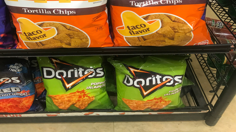 Two bags of Doritos Taco Flavor Tortilla Chips with the retro Doritos logo