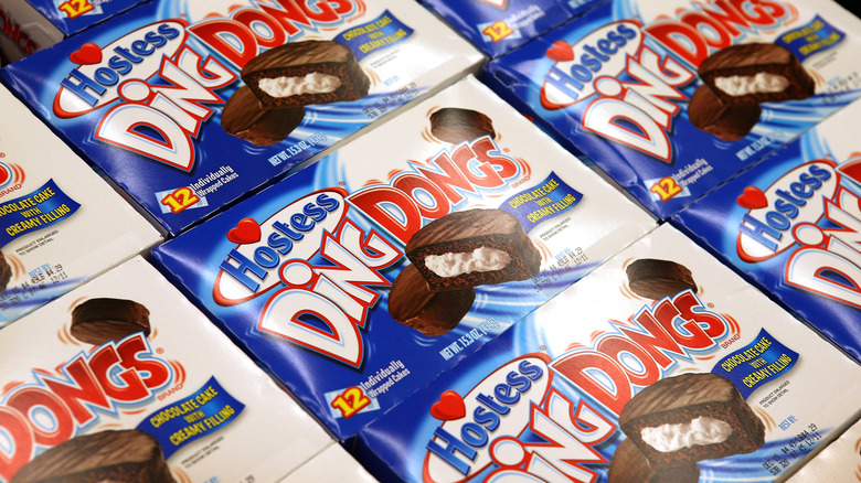 Several boxes of Hostess Ding Dongs with the modern logo