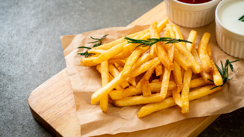 French fries on cutting board