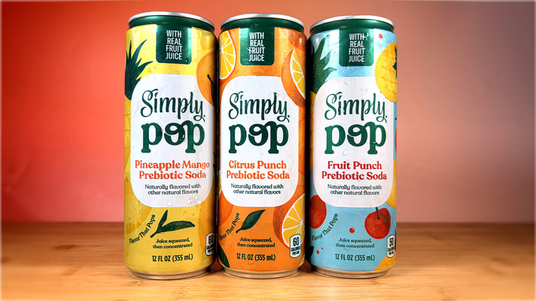 cans of simply pop prebiotic soda on a table