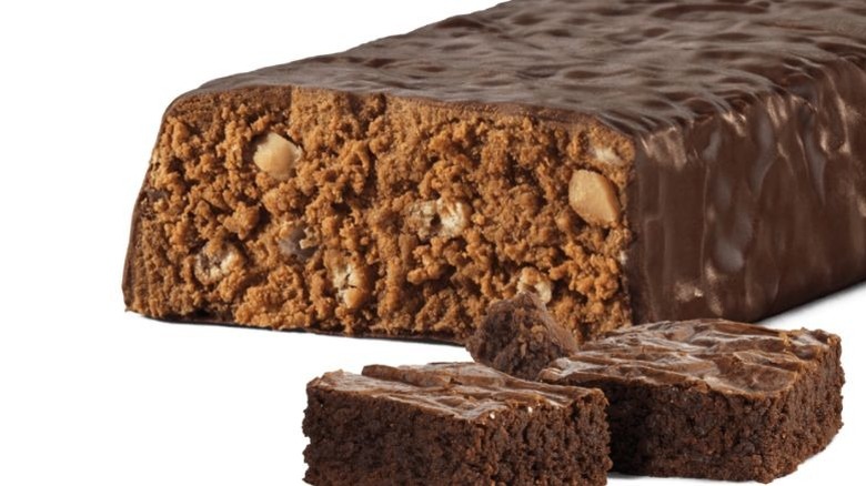 A PowerBar Protein Plus: Fudge Brownie bar broken open to show insides