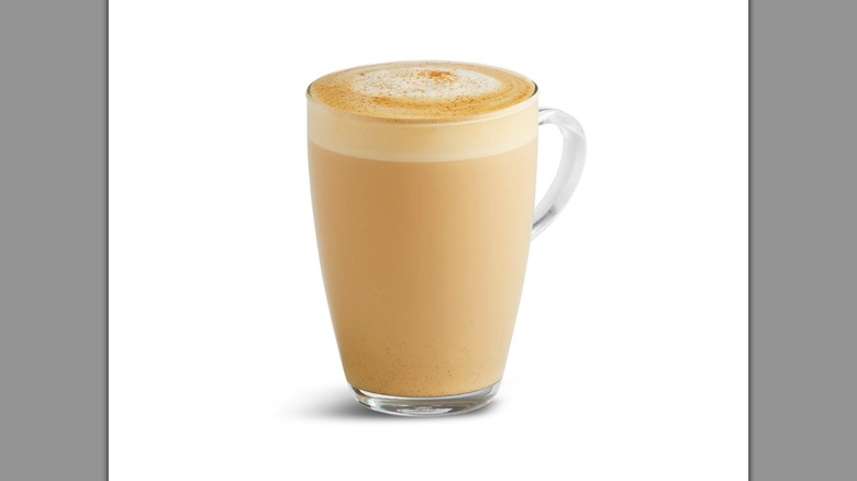 A latte in a clear glass