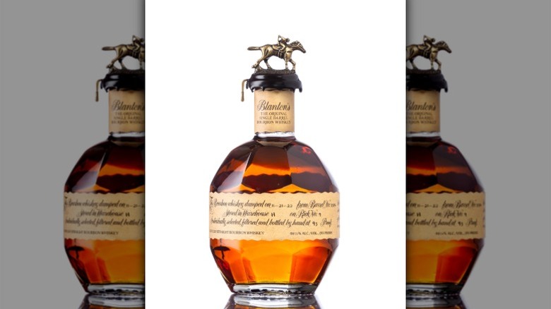 An unopened bottle of Blanton's Bourbon against a white background