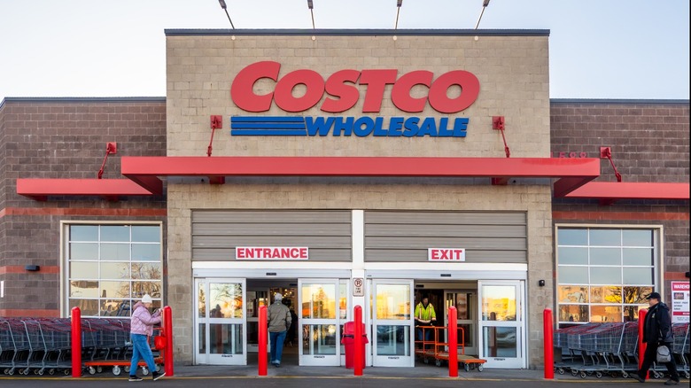A Costco storefront with customers entering and exiting