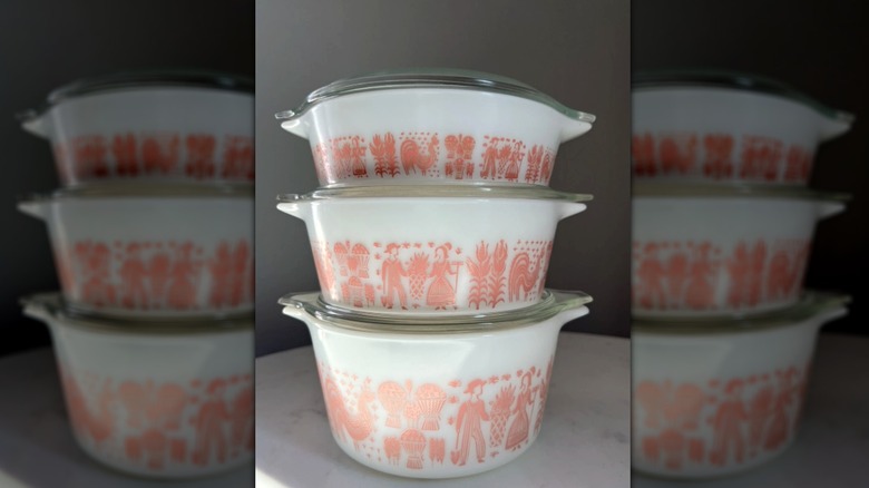 set of pyrex mixing bowls with pink Amish farm design