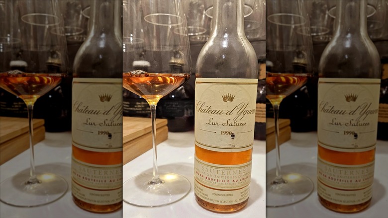open bottle and poured glass of chateau dyquem wine