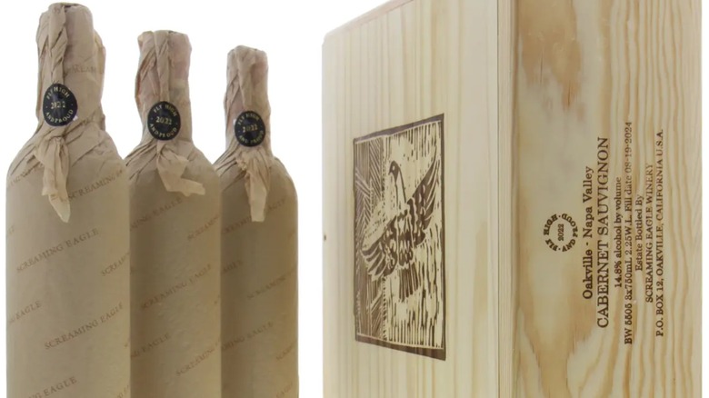 three wrapped bottles of screaming eagle with original wooden case