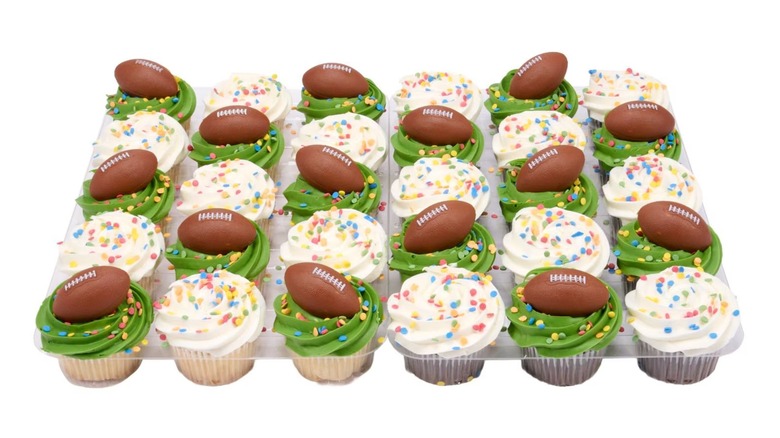 Green and white cupcakes with footballs