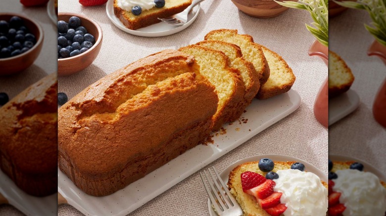 A French Vanilla Pound Cake surrounded by berries and cream